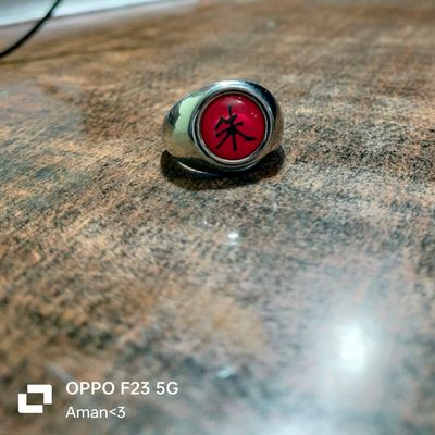 I did the Itachi's Akatsuki ring in sterling silver 925 with a red coral  paste stone. The stone and the upper symbol are attached with bi-component  cement. The ring design and ideogram