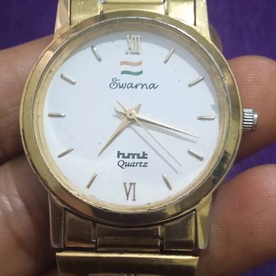 Hmt quartz 2024 swarna watch price