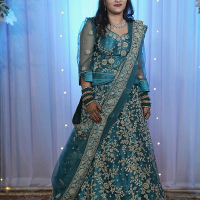 Check out the elegant Excellent Grey Heavy net Lehenga Choli -