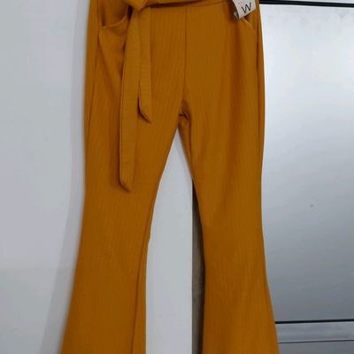 Zara primary yellow flare pants Small stains on end... - Depop