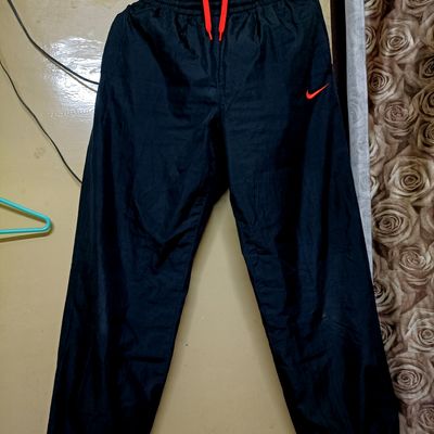 Nike Sportswear TROUSER - Tracksuit bottoms - black/light orewood/black -  Zalando.co.uk