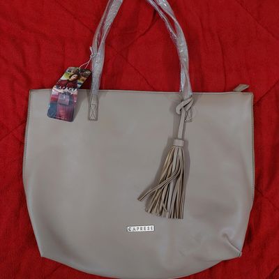 Buy Caprese Pink Solid Shoulder Bag - Handbags for Women 7785984 | Myntra
