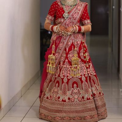 Silk Fabric Dazzling Embroidered Bridal Lehenga in Rani Color For Wedding