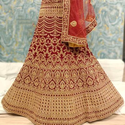 Photo of A bride in maroon lehenga with double dupatta