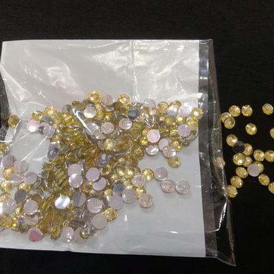 Lot of 100 golden sew on beads