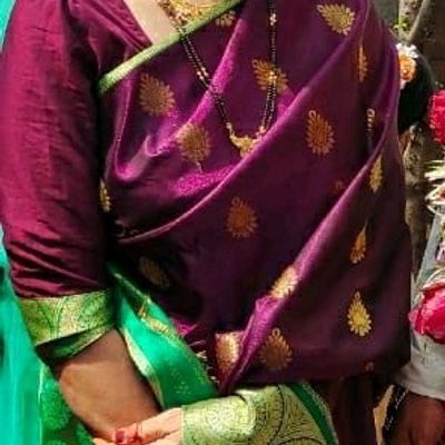 Latest Banarasi SIlk Saree Design in Purple with Green Blouse