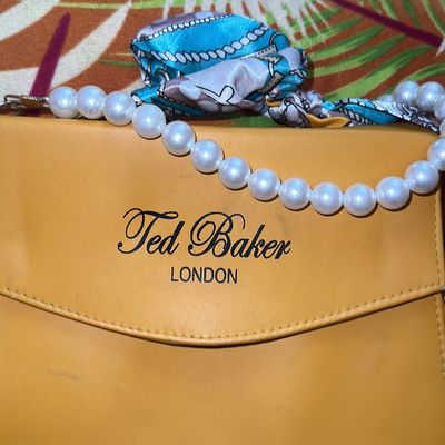 Women Plain Zipper Closure Ted Baker Pearl Sling Bag at Best Price in  Mumbai | Sipher Collection